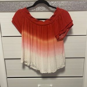 Xhileration top. Lightly worn. I’m good condition